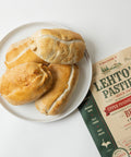 Lehto's pasties on a white plate beside a four-pasty bag of Lehto's Beef Pasties.