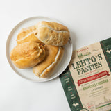 Lehto's pasties on a white plate beside a four-pasty bag of Lehto's Broccoli Cheddar Pasties.