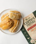 Lehto's pasties on a white plate beside a four-pasty bag of Lehto's Chicken Pasties.